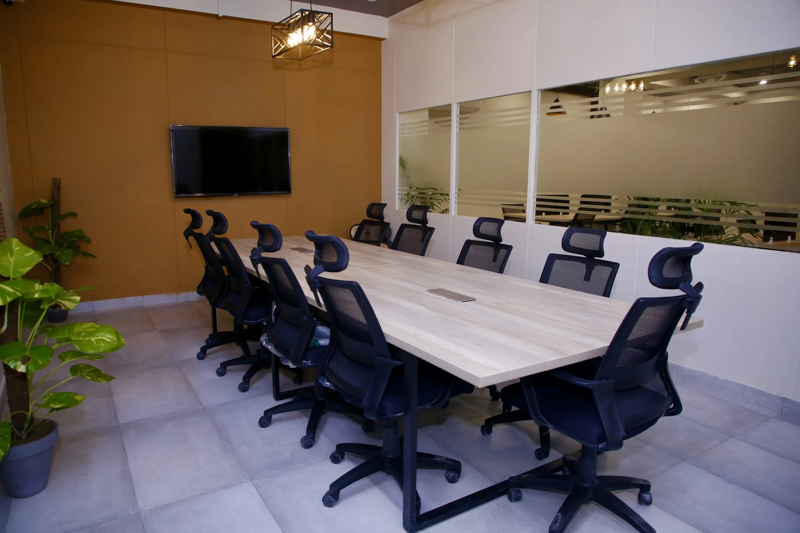 The conference room at WorkBench, a long table ringed with chairs