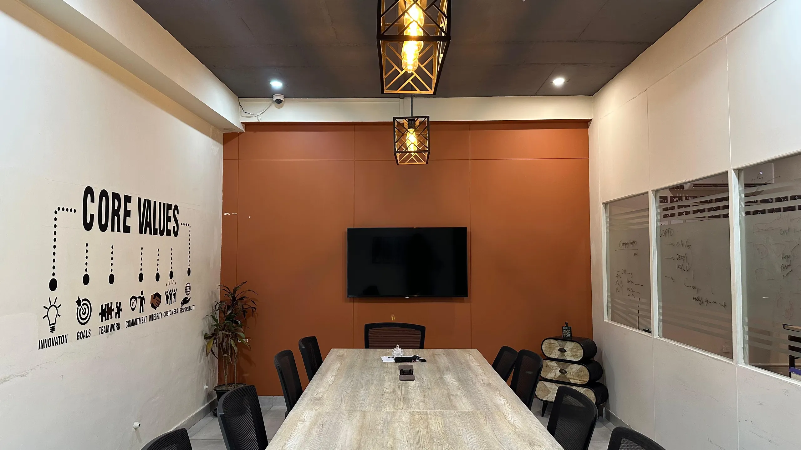 Meeting room with terracotta wall and long table